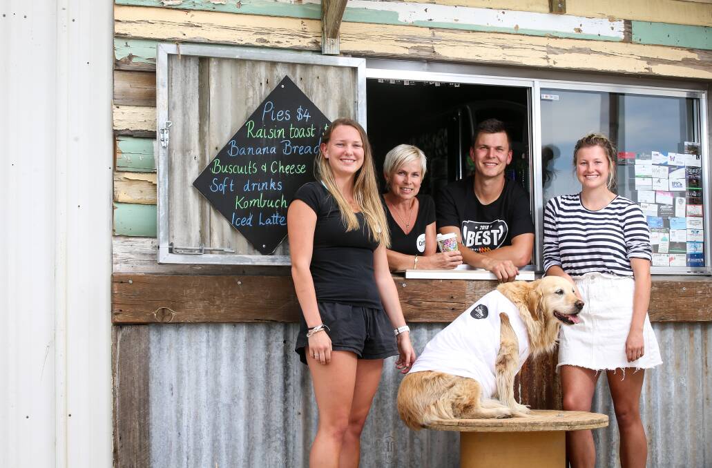 STOP IN: Abbey Little, Janiene Tait, Sam Skinner and Samantha Little with Tas at The Coffee Shed Wodonga, open 5.30am to 11am weekdays. Picture: JAMES WILTSHIRE