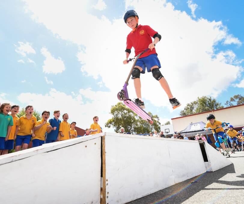 HIGH-FLYER: Year 5 student Sam Guthrie, 11, takes to the skies for a slice of $500 in prizes at the St Johns Luthern School scooter competition. Picture: MARK JESSER