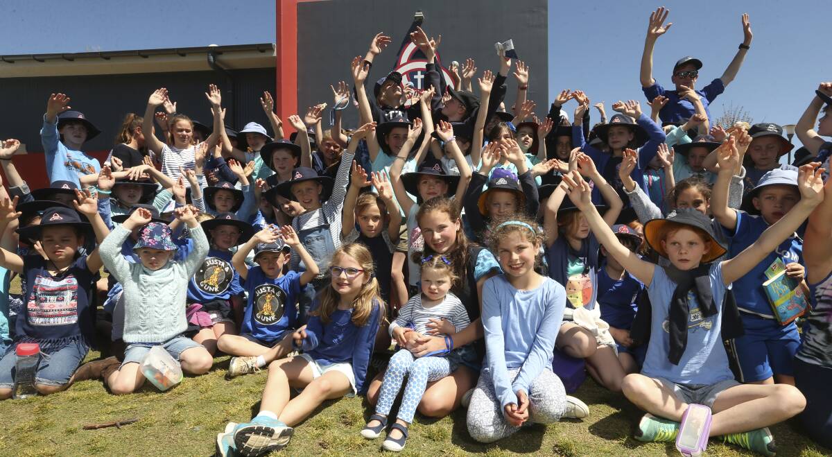 TOGETHER: Trinity Anglican College was a sea of blue on Tuesday, 3-year-old Ginger Salisbury's favourite colour. Pictures: ELENOR TEDENBORG