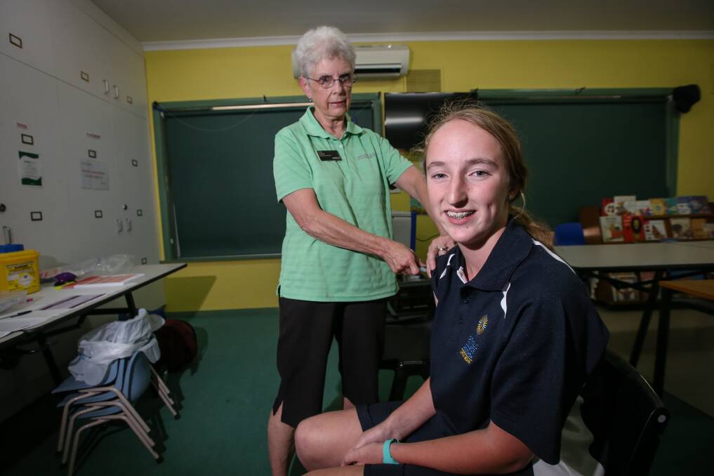 KEEP IT UP: Wodonga Council immunisation nurse Pat Last with Steph Martin, 12, at the Trudewind Neighbourhood House immunisation session. Council holds numerous sessions each month for many ages. Picture: JAMES WILTSHIRE