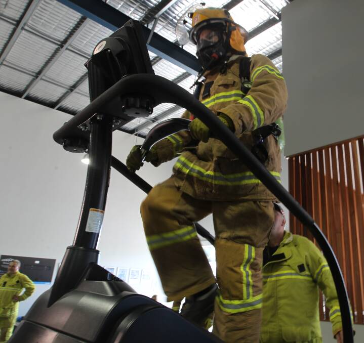 ONLY WAY IS UP: Baranduda firefighter Gary Reid hits the stair climber as a warm-up to tackling 28 floors of the Crown Metropol Hotel for the Melbourne Firefighter Stair Climb on September 3. Pictures: ELLEN EBSARY 