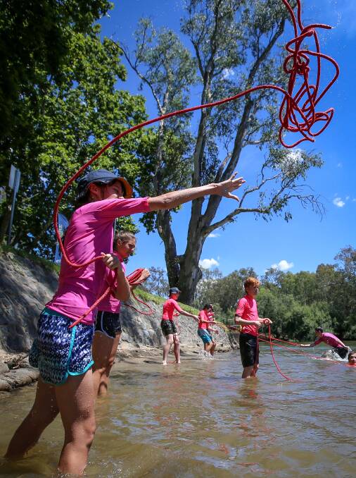 LIFESAVERS: Sachi Kerr, 14, from Catholic College Wodonga practices throwing a rope, a skill which could potentially save a life during Life Saving Victoria's Open Water Learning Experience. Picture: JAMES WILTSHIRE