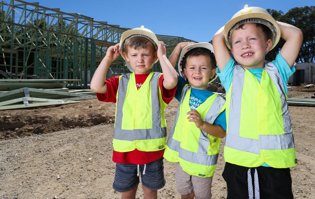 SAFETY FIRST: Springdale Heights Pre-School students Benji Lowe, 4, Coby Jones, 4 and Madex Formosa, 4, take a tour of the construction site. Picture: MARK JESSER