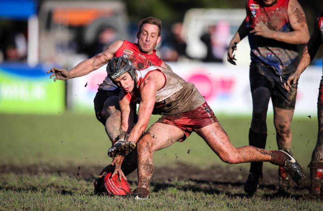 ROUGH STUFF: Overnight rain made the ground at Corryong an absolute mud pit, but that didn't stop the likes of Federal's Daniel Bond going in hard. 