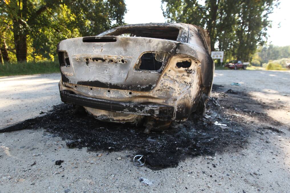 The sedan was torched in the Hume spillway carpark on Friday morning.