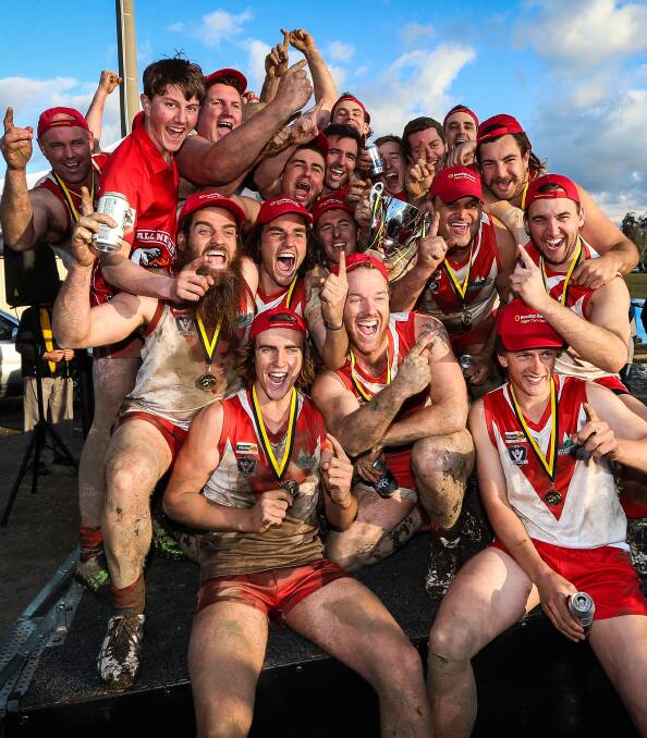 WINNERS ARE GRINNERS: The Swans will have bragging rights at Corryong Reserve, which they share with the Demons, after their grand final win. Pictures: JAMES WILTSHIRE