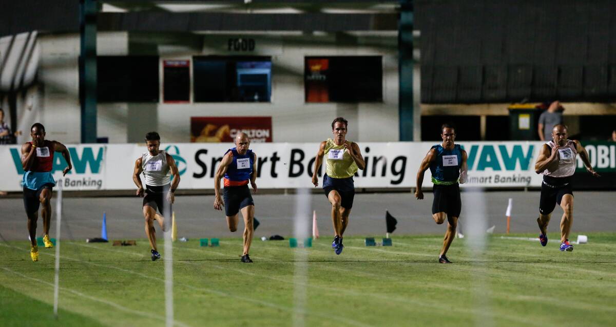 CLOSE ONE: Essendon's Paul Tancredi (white singlet, left) won the Wangaratta Gift in a hotly contested photo finish on Saturday night. Picture: MARK JESSER