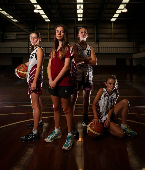 READY TO RUMBLE: Under 16s Wodonga Wolves players Casey Ardern, 14, coach Lauren Ardern, Izzy Delcour, 13, and Charli Conway, 13, will be looking to make an impact at the tournament this weekend. Picture: JAMES WILTSHIRE