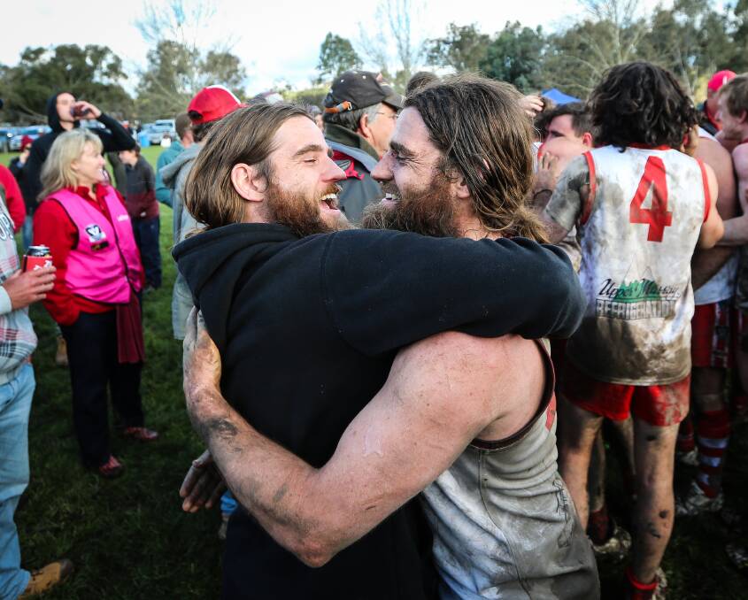 NO JOKE: Justin Nelson, of the comedy duo The Nelson Twins, celebrates with brother Chris after winning the Upper Murray grand final with Federal. 