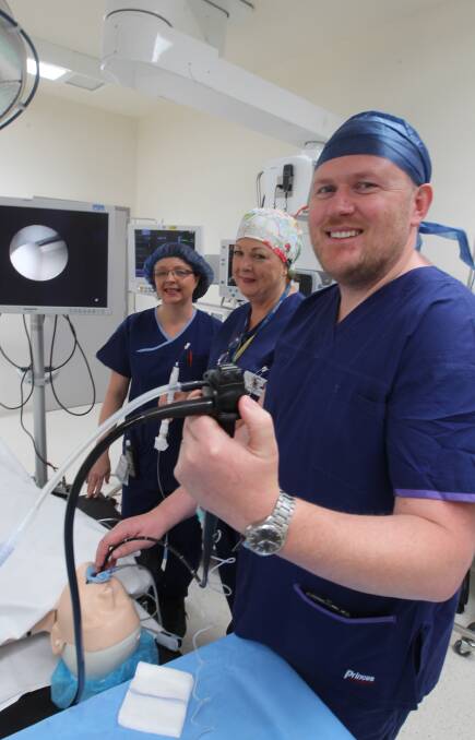 BREAKTHROUGH: Nurses Robyn Goldsworthy and Rose Rout with Dr James Robertson and the E-Bus equipment, which helps diagnose lung cancer. Picture: CHRIS YOUNG