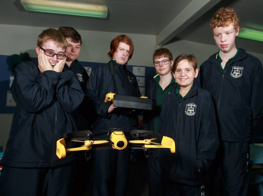 NEW HEIGHTS: Aspect students George Webster, 13, Mitch Wright, 15, Lachlan Sommerfeld, 15, Jake Rosser, 13, Summer Halford, 14, and Adam Lippiatt, 14, use their drone. Picture: SIMON BAYLISS