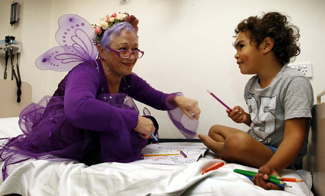 MAGIC: Wagga Rural Referral Hospital's 'Purple Princess' Wendy Swann with four-year-old patient Dwayne Byers-Honeysett. Picture: Les Smith.