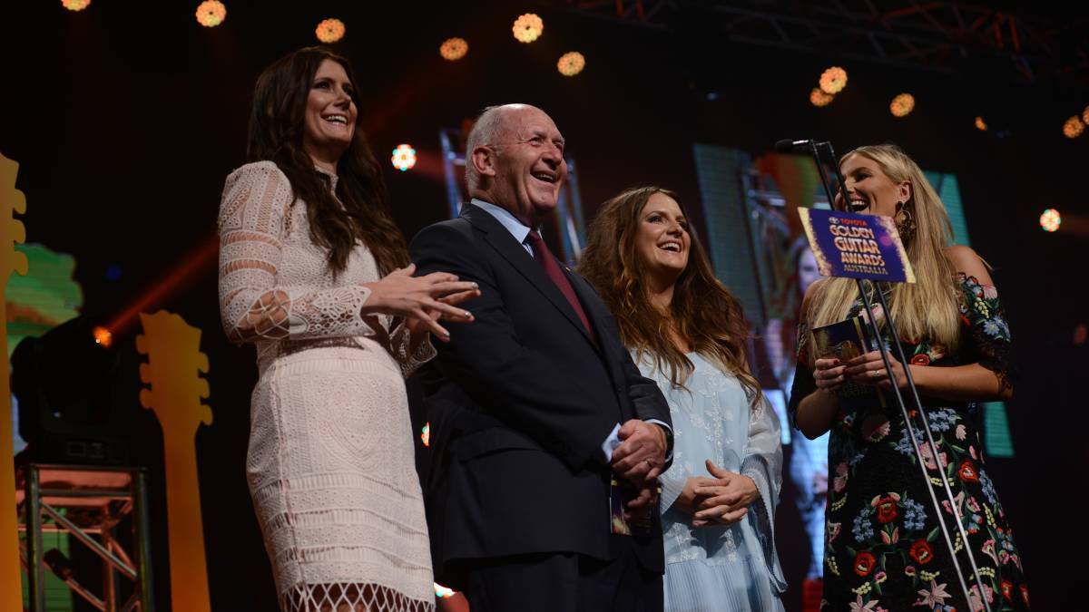 Some serious star power on stage together at the Golden Guitars; The McClymonts, Mollie, Brooke and Sam with Governor-General Peter Cosgrove. Photo: Gareth Gardner.