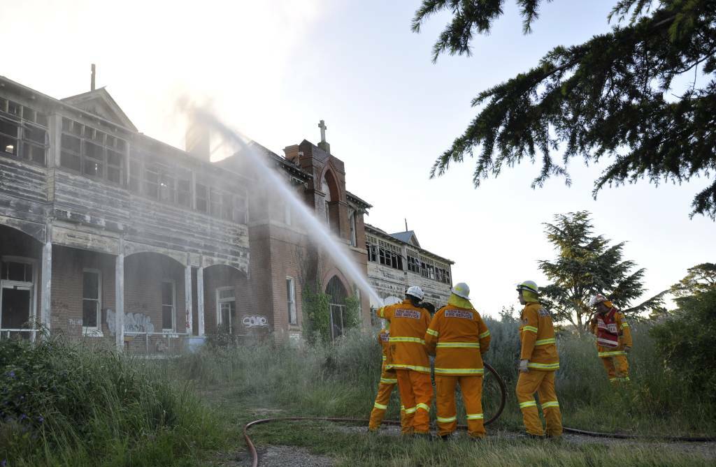 Firefighters tackle the blaze at St John's orphanage head on.