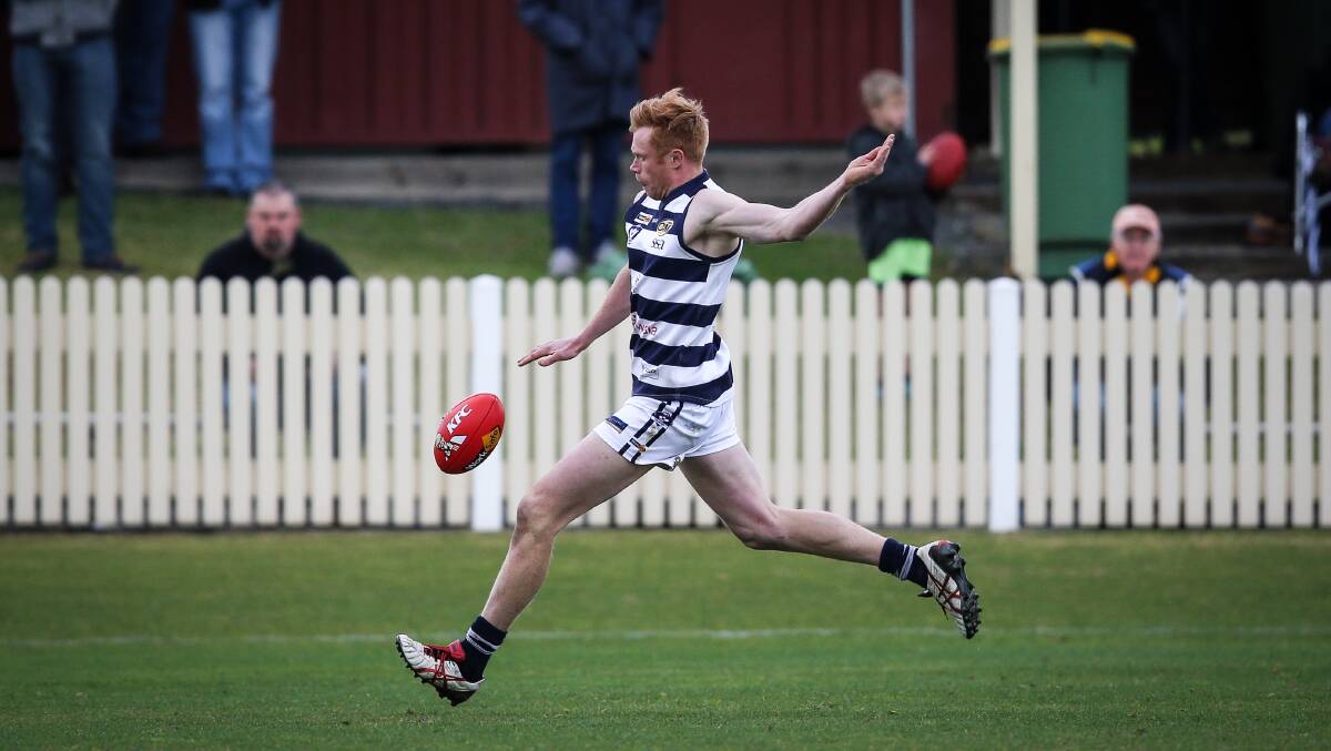 LONG BOMB: Yarrawonga's Brandon Symes gets a kick away. Picture: JAMES WILTSHIRE