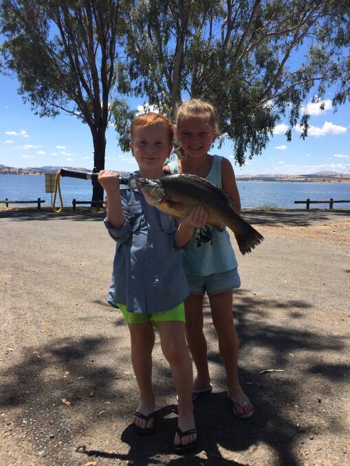 PROUD: Jesse Ball-Smallpage, 5, and Olivia Smallpage, 8, with a nice 47-centimetre yellowbelly they caught at Bowna.