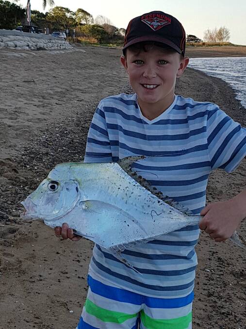 RIPPER: The Clarke family recently stayed with family at Boyne Island. Zachary Clarke, 10, caught this large diamond trevally at the mouth of the Boyne River. Boyne Island is about 30 minutes south of Gladstone.