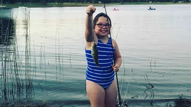 HOLIDAY CATCH: Gracie Ingram, 8, caught her first ever fish, a small redfin at Lake Hume's Boat Haven Resort during the January school holidays. 