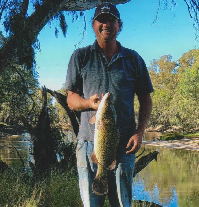 SENSATIONAL: Keen fisherman Trevor Britton was all smiles after nabbing this beautiful 60 centimetre Murray Cod near Narrandera on New Year's Day. 