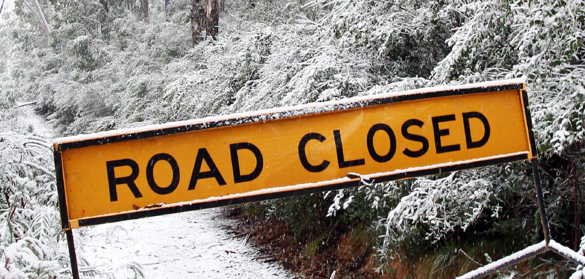 Heavy snowfall closed road between Harrietville and Hotham Heights