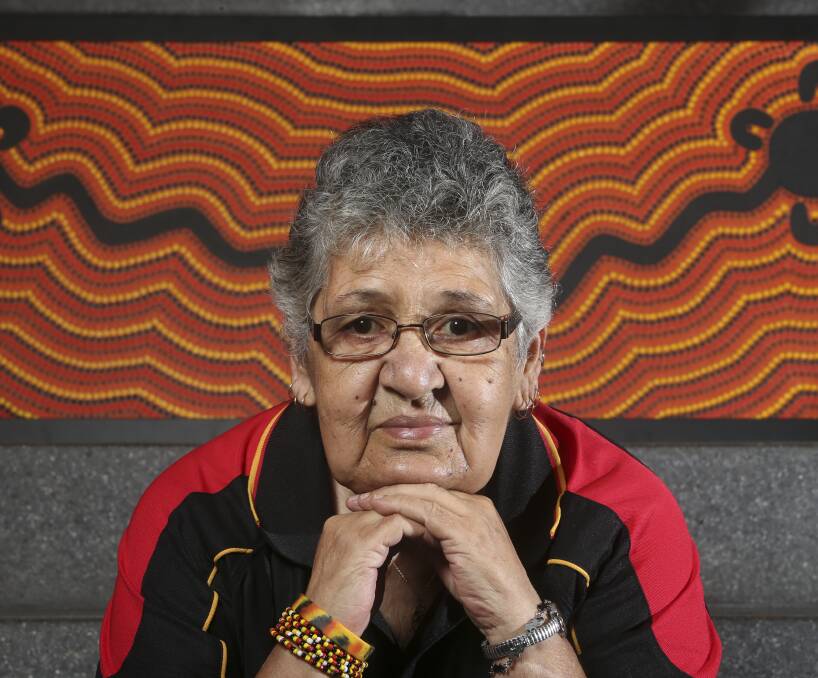 ENLIGHTENED: Aunty Avis Gale sits a calm and happy woman in front of her artwork 'Sorry Camp' which will be shown in an exhibition on Saturday. Picture: ELENOR TEDENBORG