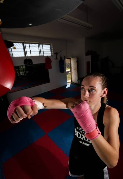FISTS OF FURY: Tanisha Devlin works over a speed bag in the Southern Cross Boxing gym.