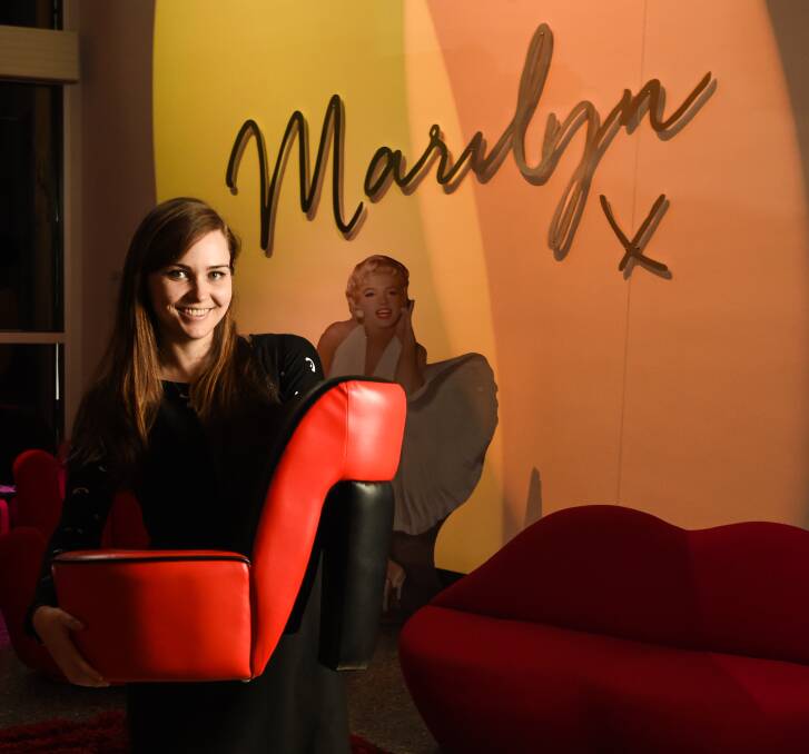 MARILYN MAYHEM: MAMA education officer Hannah Mitchell with a custom-made shoe seat which will go up for auction. Picture: MARK JESSER
