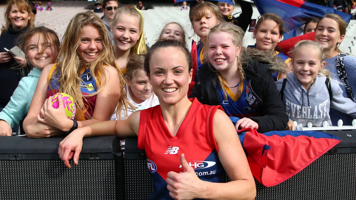 STAYING IN MELBOURNE: Daisy Pearce celebrates with supporters in the crowd after winning the 2016 AFL Womens match between the Melbourne Demons and the Brisbane Lions in May. Picture: SCOTT BARBOUR/AFL/GETTY IMAGES