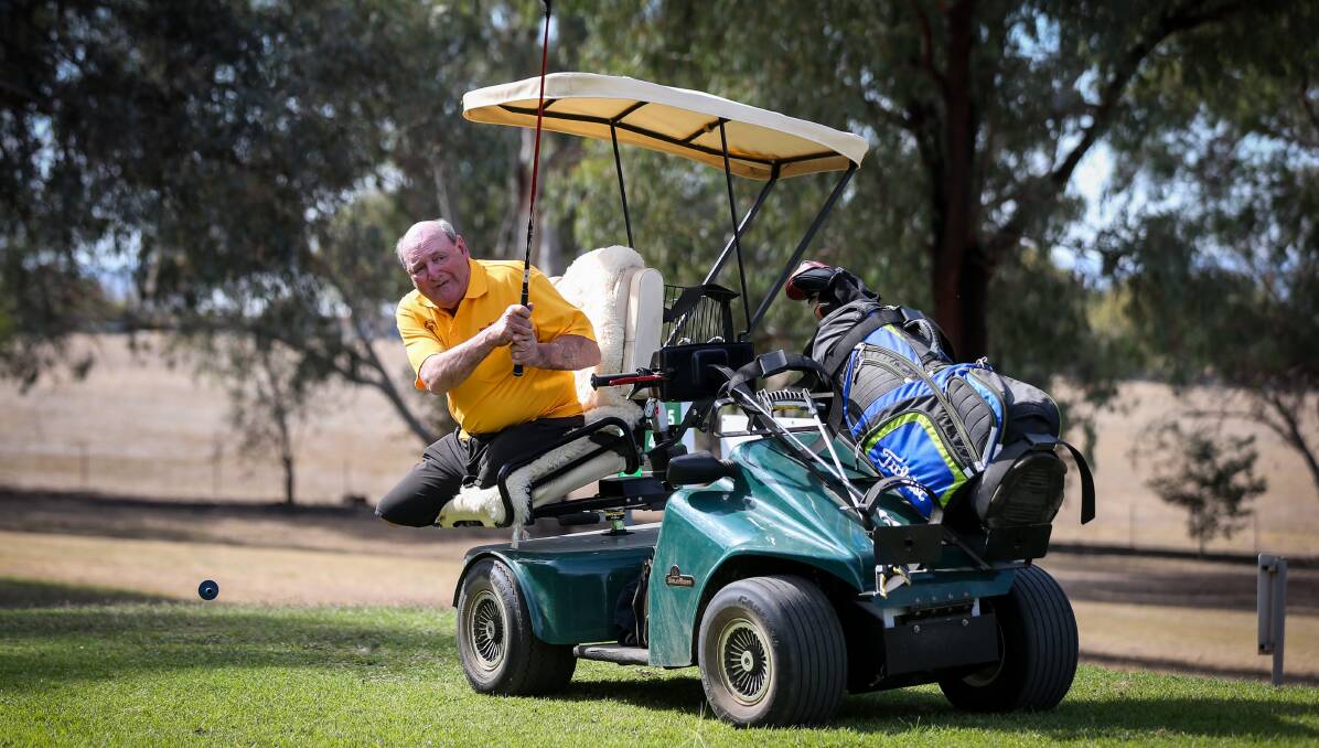 INSPIRATION: Thurgoona's Allan Justin hasn't let the loss of his legs get in the way of playing a relaxing game of golf. Picture: JAMES WILTSHIRE
