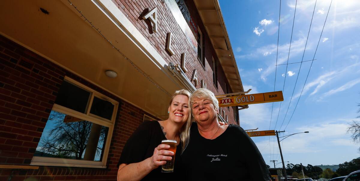 HERE'S CHEERS: Sally Ansell, left, and Julie Sanson are part of the newlook management of the Tallangatta Hotel that re-opens on Wednesday. Picture: MARK JESSER