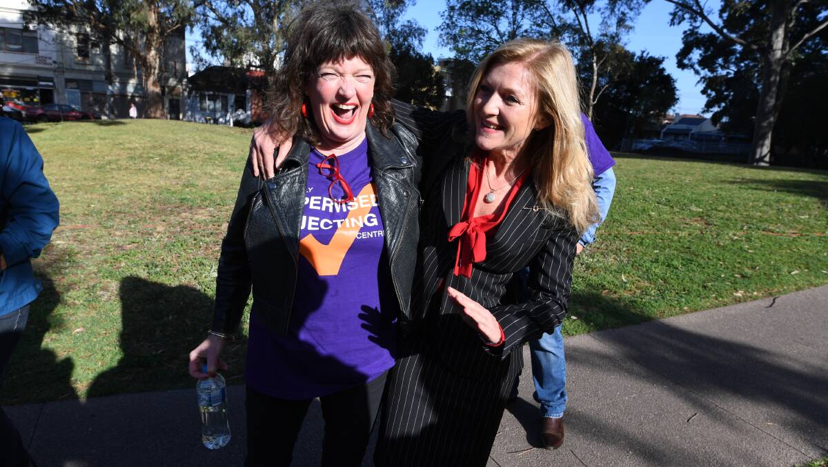 Judy Ryan, left, and Victorian MP Fiona Patten rejoice after Premier Daniel Andrews agrees to a two-year trial for a medically supervised drug injecting facility in inner Melbourne on Tuesday. Picture: FAIRFAX MEDIA