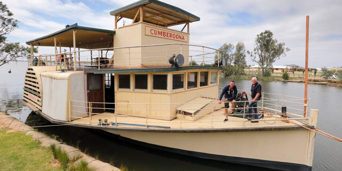 GREEN LIGHT: The Cumberoona paddlesteamer has the all clear to begin operating for the first time since 2007. Robbie Knowles, left, and father Wayne helped bring the boat to Yarrawonga this year.