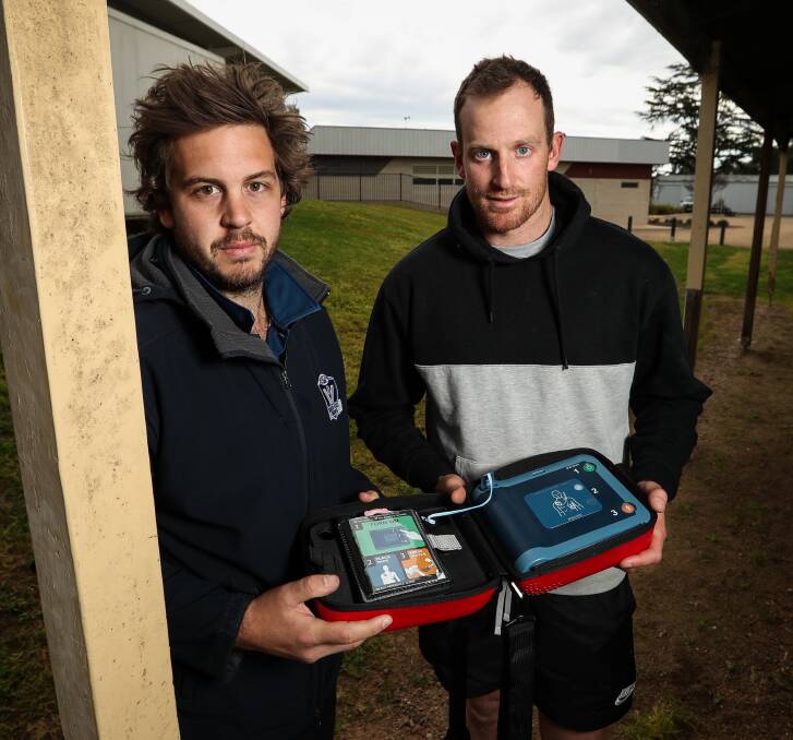 LIFE SAVERS: Wangaratta Magpies' duo Zac Hedin and Mick Newton were among those who helped revive Barry Grant on Tuesday. Picture: JAMES WILTSHIRE