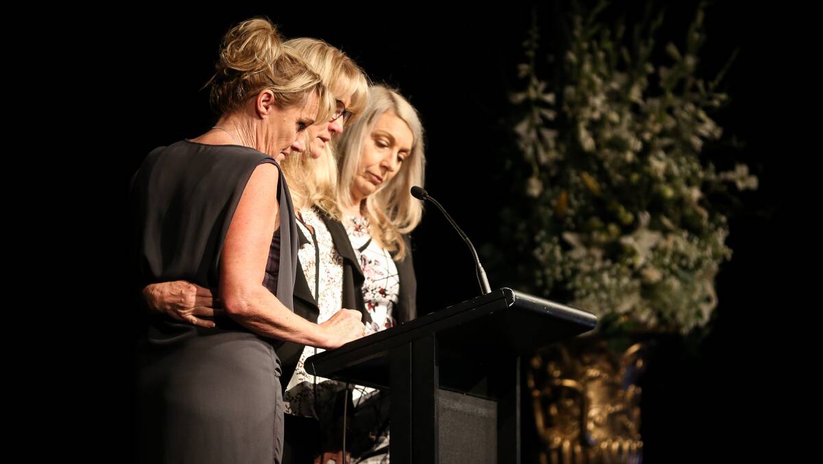 The late Les O'Brien's daughters at his funeral in Albury last year.