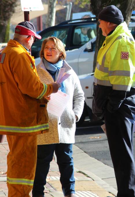 BURNING ISSUE: Indi Liberal candidate Sophie Mirabella chats with CFA volunteers in Wangaratta on Saturday.