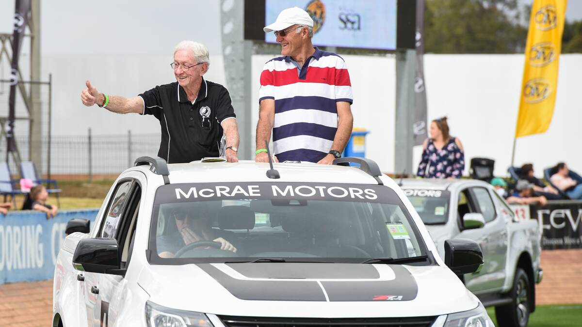THUMBS UP: Ovens and Murray Hall of Fame inductees, Kevin Allan, left and Norm Bussell, took part in parade of champions before grand final. PIcture: MARK JESSER