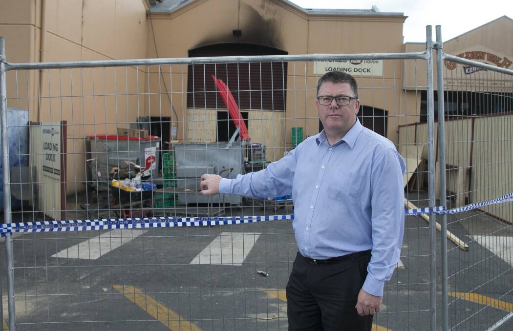 INSPECTION: EPA chief executive officer Nial Finegan visited the fire-damaged Beechworth supermarket site on Friday. Picture: ELENOR TEDENBORG