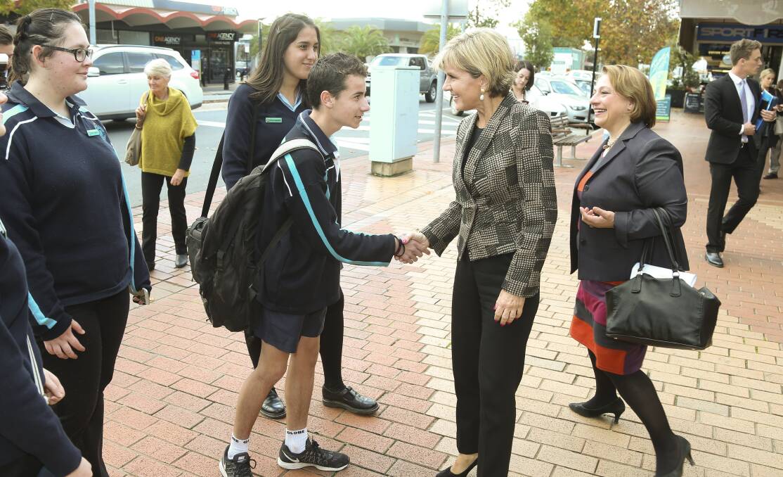 MEET AND GREET: Julie Bishop meets Wodonga students April Attaridge, 17, Portia Stowers, 16, and Jye McBurnie, 15, in High Street on Friday.