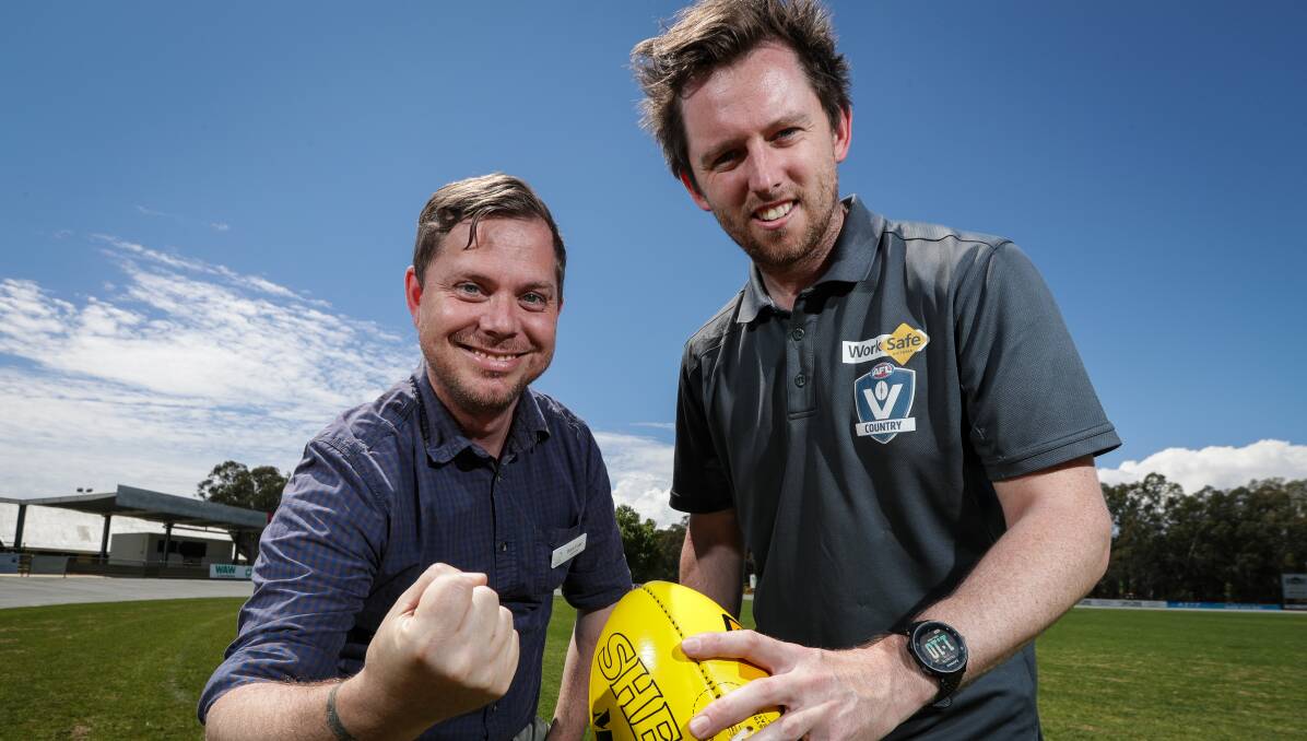 BRING IT ON: Cr David Fuller, left, and AFL North-East Border operations manager Zac Guilfoyle welcome the Richmond-Essendon pre-season match announcement. Picture: JAMES WILTSHIRE