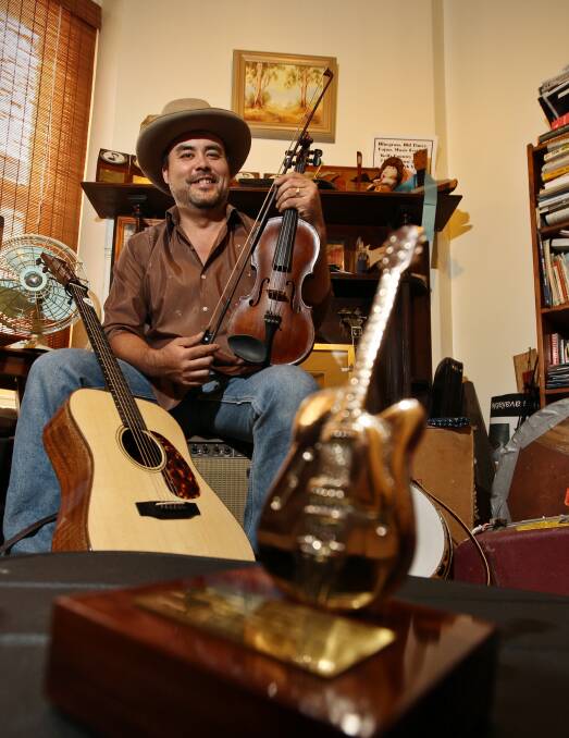 HIGH FIVE: Yackandandah's Pete Denahy has boosted his Golden Guitars tally to five. He won instrumental of the year and Bluegrass recording of the year.
