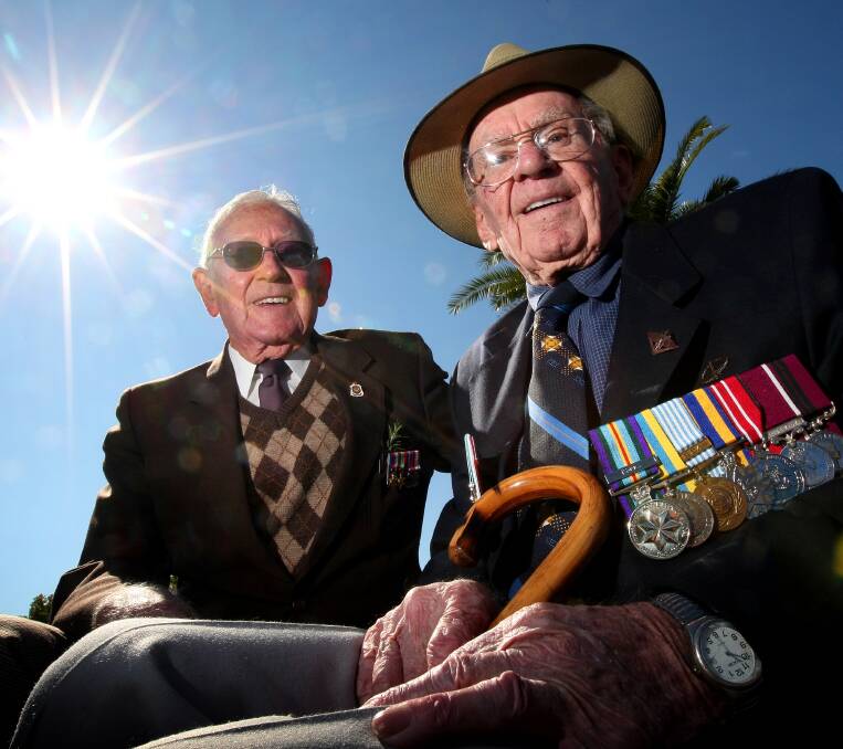 SERVICEMAN: Jack Eames, left, served in New Guinea during World War II. He is pictured with John "Curly" Hunt in 2011.