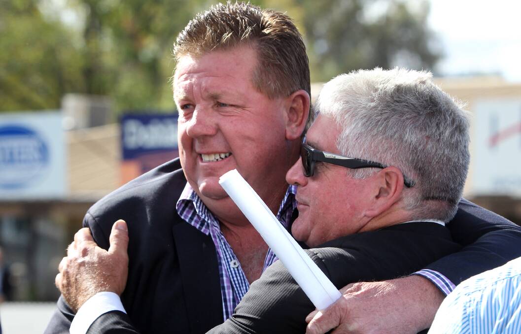 MAGIC MOMENT: Albury trainer Brett Cavanough is congratulated by Loved Up part-owner and Albury Racing Club director Gerald Judd after the 2015 Albury Guineas.