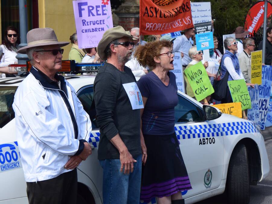 MAKING A STAND: Protesters outside the Albury Club where Prime Minister Tony Abbott was attending a morning tea for community groups and volunteers.