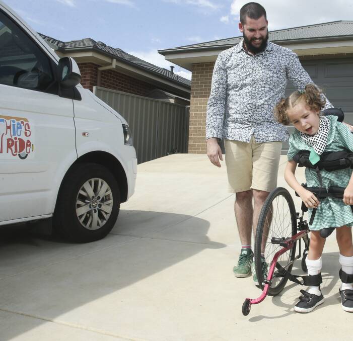 MEGA CHALLENGE: Stephen and Zoe Neville with their daughter Ruthie. Mr Neville will play his drums on Dean Street for 24 hours to raise money for their accessible van. Picture: ELENOR TEDENBORG