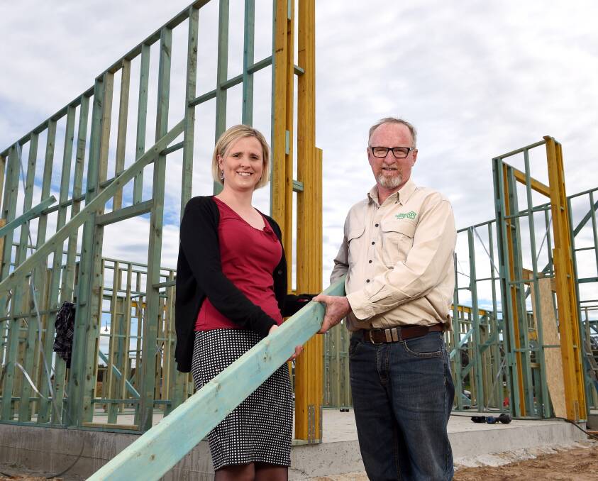 CONSTRUCTION FOR A CAUSE: Jane Evans went to check on the home with David Hawkins. Profits from the property's auction will go to the Albury Wodonga Regional Cancer Centre Trust Fund. Picture: MARK JESSER