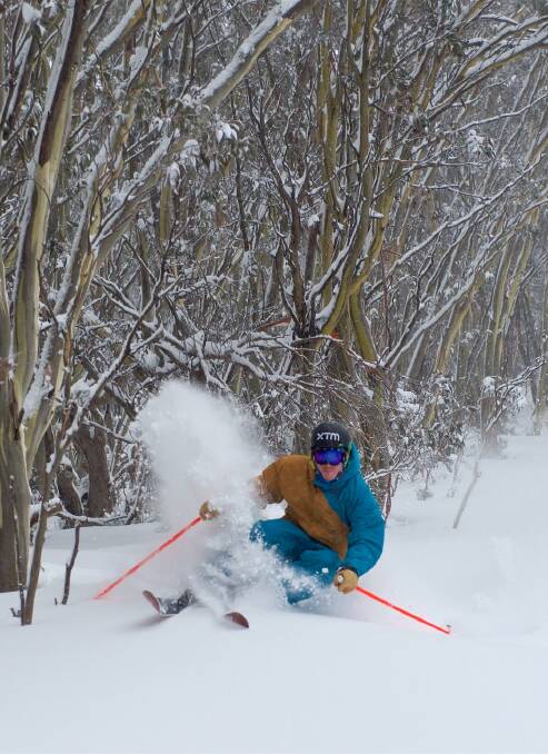 BLIZZARD: A skier enjoys the snowfall at Falls Creek. Picture: CHRIS HOCKING