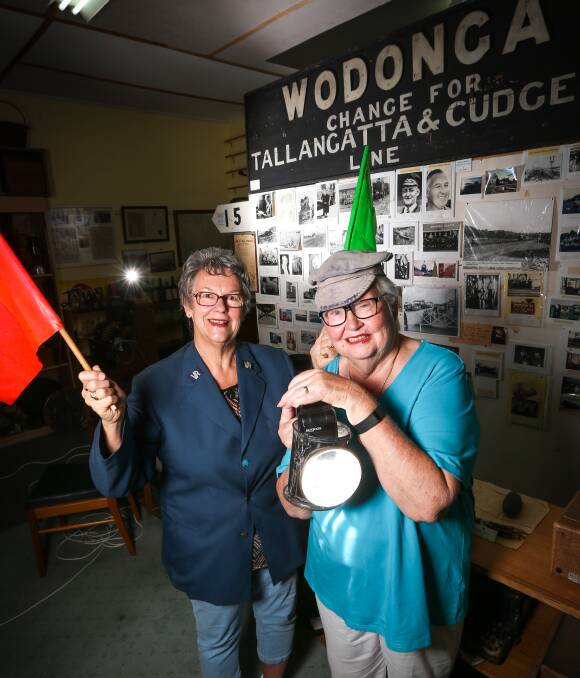 OLD UNIFORMS: Wodonga Historical Society members Uta Wiltshire and Marie Elliot with old railway items on display at their site on South Street. Picture: JAMES WILTSHIRE