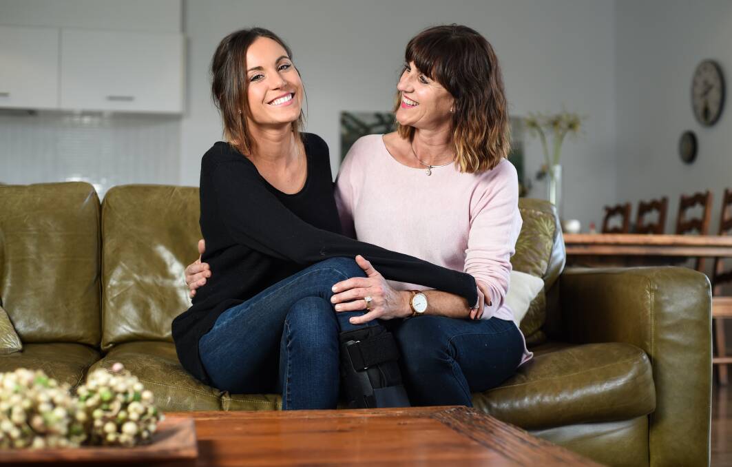 ALWAYS THERE: Emily and her mum Janet Wornes, who was in hospital at San Diego and Melbourne with Emily every day and has helped care for her since. Picture: MARK JESSER