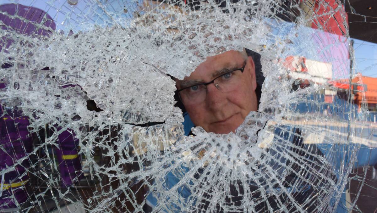 GETTING ANSWERS: Sportfirst co-owner Michael Hales was in disbelief when his business was targeted in a bold morning attack. Picture: BLAIR THOMSON