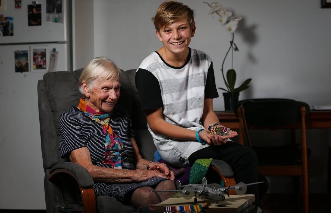 ONE YEAR ON: Pat Biles and Kobey-Flynn Hudec look at model planes and old war memorabilia, as they remember Walter 'Wally' Biles in the lead up to ANZAC Day. Picture: JAMES WILTSHIRE